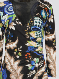 Elevate your summer style with the Foliage Wrap Mini Dress by Roberto Cavalli, a stunning piece that exudes elegance and charm. Featuring a vibrant floral print and a flattering wrap silhouette, this dress is sure to turn heads wherever you go. Perfect for daytime brunches or evening soir��es, this dress is a must-have for the fashion-forward woman looking to make a statement.