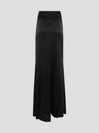 Indulge in effortless sophistication with the Black Draped Maxi Skirt by Roberto Cavalli. Made from luxurious, flowy fabric, this skirt drapes gracefully to create a flattering silhouette that exudes elegance. Whether you're heading to a black-tie event or a casual day out, this skirt will elevate your style with its timeless appeal.