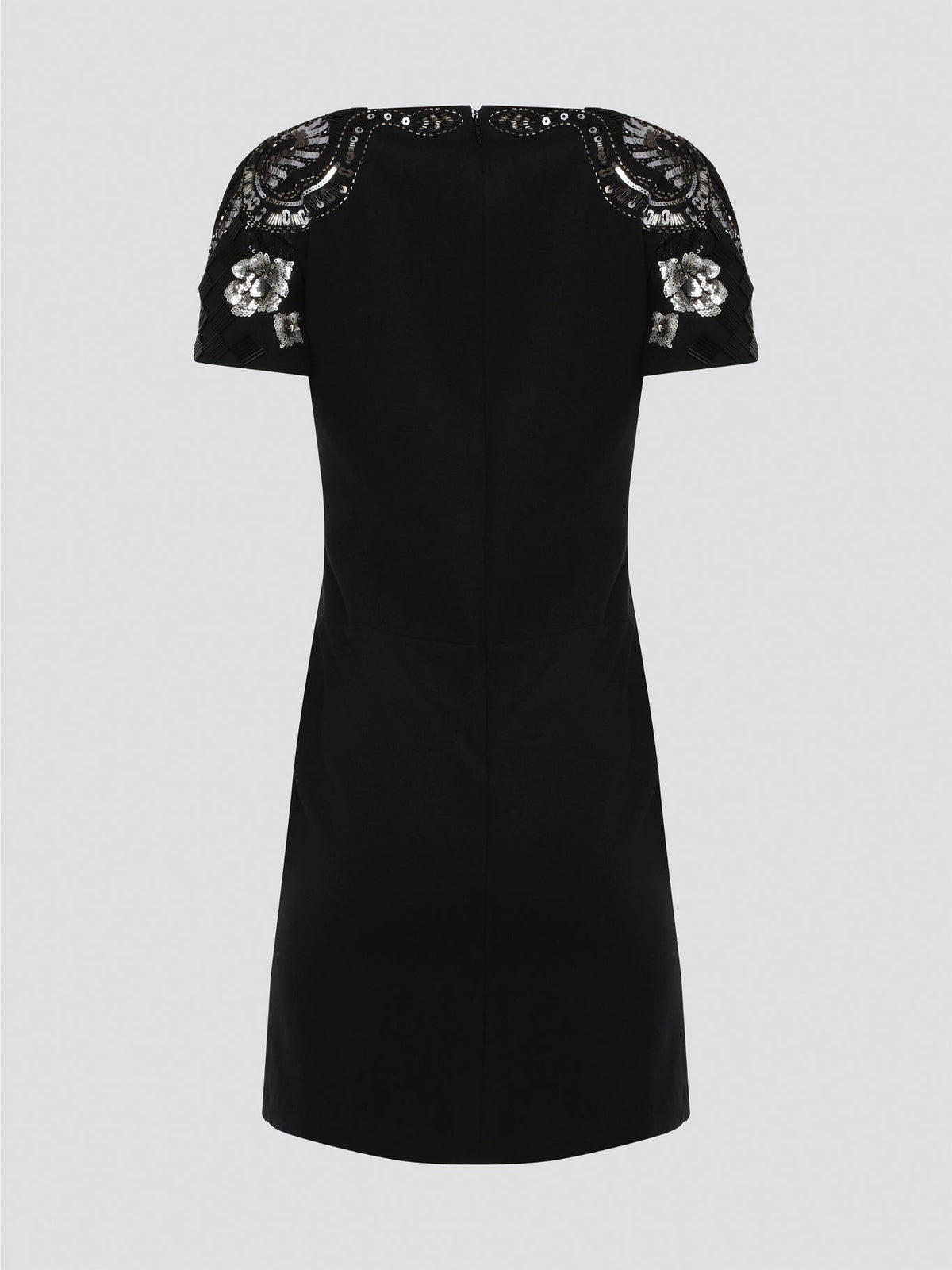 Step out in style and sophistication with our Black Embellished Plunge Dress by Roberto Cavalli. This stunning piece features intricate beadwork and shimmering embellishments that are sure to turn heads. The plunging neckline adds a touch of allure, making it the perfect choice for your next special occasion. Elevate your wardrobe with this show-stopping dress that exudes luxury and glamour.