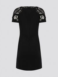 Step out in style and sophistication with our Black Embellished Plunge Dress by Roberto Cavalli. This stunning piece features intricate beadwork and shimmering embellishments that are sure to turn heads. The plunging neckline adds a touch of allure, making it the perfect choice for your next special occasion. Elevate your wardrobe with this show-stopping dress that exudes luxury and glamour.