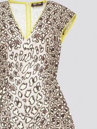Indulge in your wild side with the Leopard Print V-Neck Mini Dress by Roberto Cavalli, a daring and chic addition to your wardrobe. This statement piece exudes fierce confidence with its bold print and flattering silhouette, perfect for a night out on the town or a special occasion. Channel your inner fashionista and stand out from the crowd in this one-of-a-kind piece by a renowned luxury designer brand.