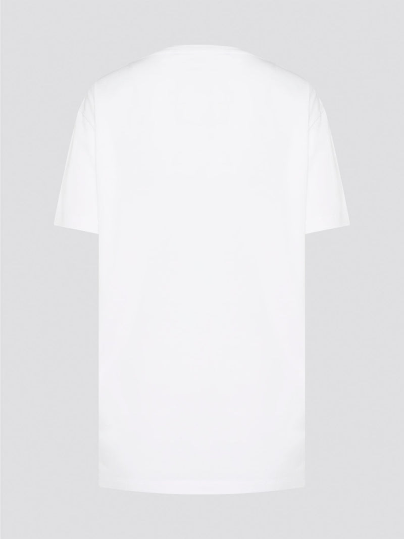 Elevate your casual style with the White Printed Oversized T-Shirt from Roberto Cavalli. Made with premium cotton fabric, this tee features a bold and eye-catching print that will set you apart from the crowd. Whether you dress it up with heels or keep it cool with sneakers, this statement piece is a must-have for your wardrobe.