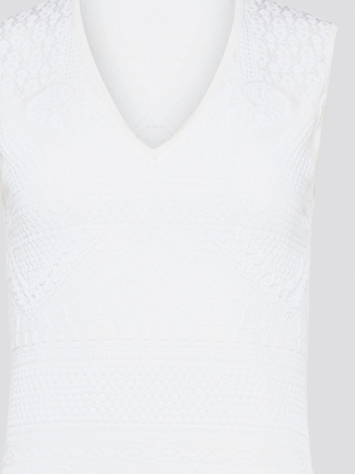 Feel effortlessly chic and sophisticated in this stunning White Sleeveless Mini Dress by Roberto Cavalli. The epitome of Italian luxury, the dress features a flattering silhouette and intricate detailing that is sure to turn heads. Perfect for any occasion, whether it's a summer soir��e or a glamorous night out, this dress is a must-have for any fashion-forward woman.