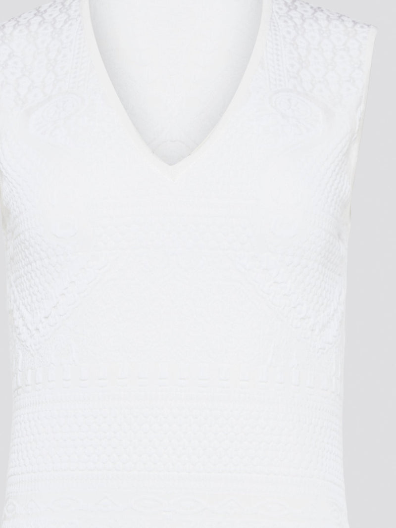 Feel effortlessly chic and sophisticated in this stunning White Sleeveless Mini Dress by Roberto Cavalli. The epitome of Italian luxury, the dress features a flattering silhouette and intricate detailing that is sure to turn heads. Perfect for any occasion, whether it's a summer soir��e or a glamorous night out, this dress is a must-have for any fashion-forward woman.