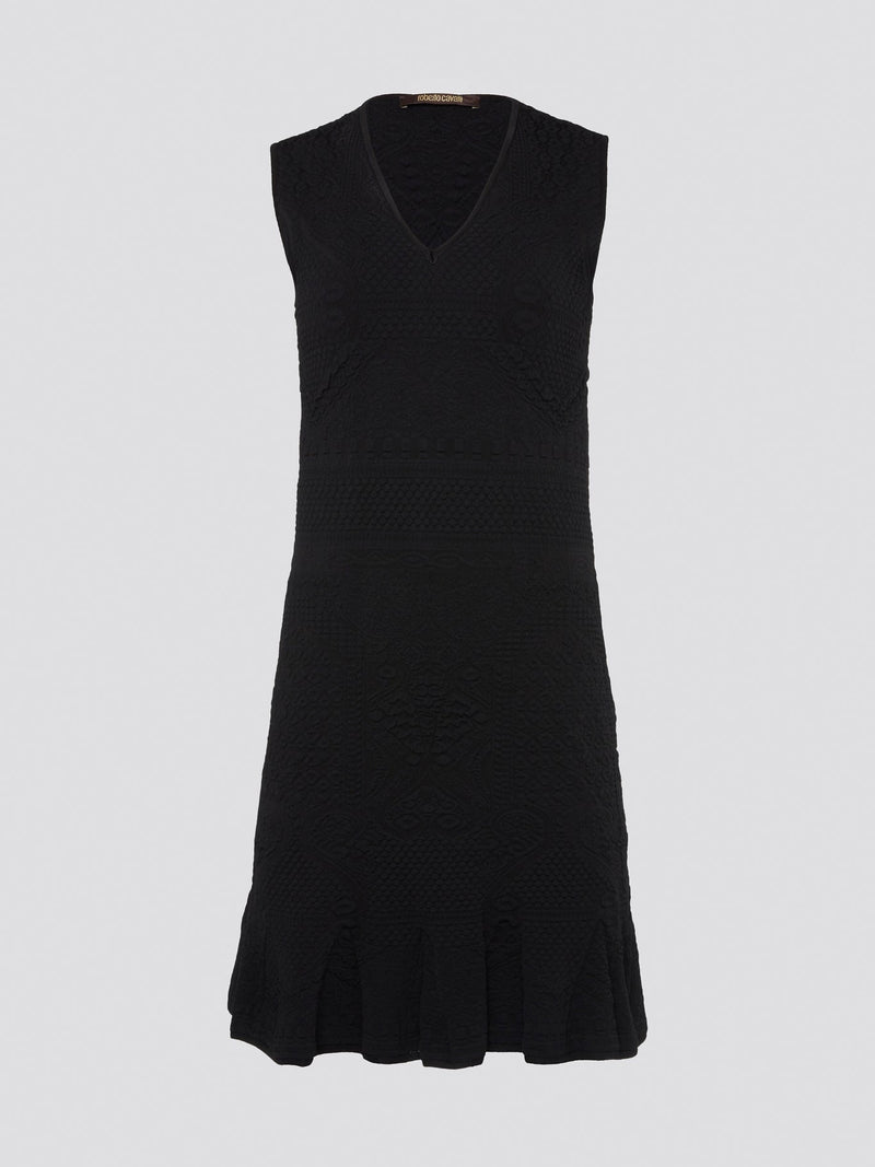 Get ready to turn heads with this stunning black sleeveless mini dress from Roberto Cavalli. This sleek and stylish design features a flattering silhouette that hugs your curves in all the right places. Whether you're hitting the town or attending a special event, this dress is sure to make a statement and elevate your look to the next level.