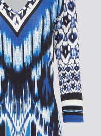 Make a statement with this striking blue printed long sleeve dress by Roberto Cavalli. The intricate design and flowing silhouette add a touch of elegance and drama to any outfit. Perfect for a night out or a special event, this dress is sure to turn heads and make you feel like a true fashion icon.