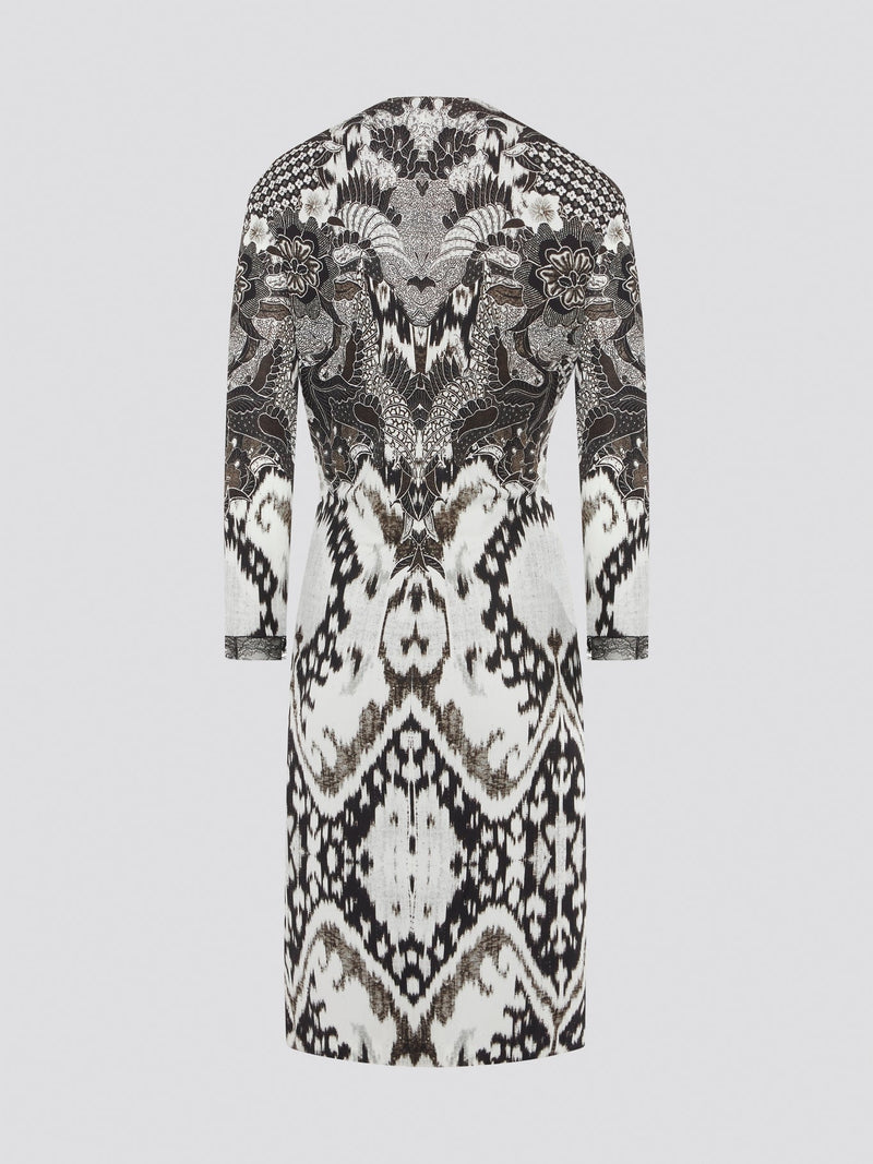 Elevate your wardrobe with this stunning Printed Long Sleeve Dress by Roberto Cavalli. The vibrant print and luxurious fabric make it a perfect choice for any special occasion or night out. Stand out in style and turn heads wherever you go in this show-stopping piece.