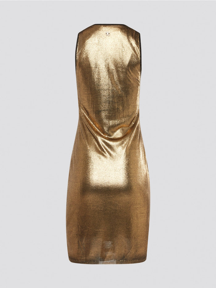 Step into the wild side with the Gold Reptilian Bodycon Dress from Roberto Cavalli. This eye-catching silhouette is adorned with a luxurious reptile print that will turn heads wherever you go. Perfect for a night out on the town, this dress is sure to make you feel like a dazzling diva.