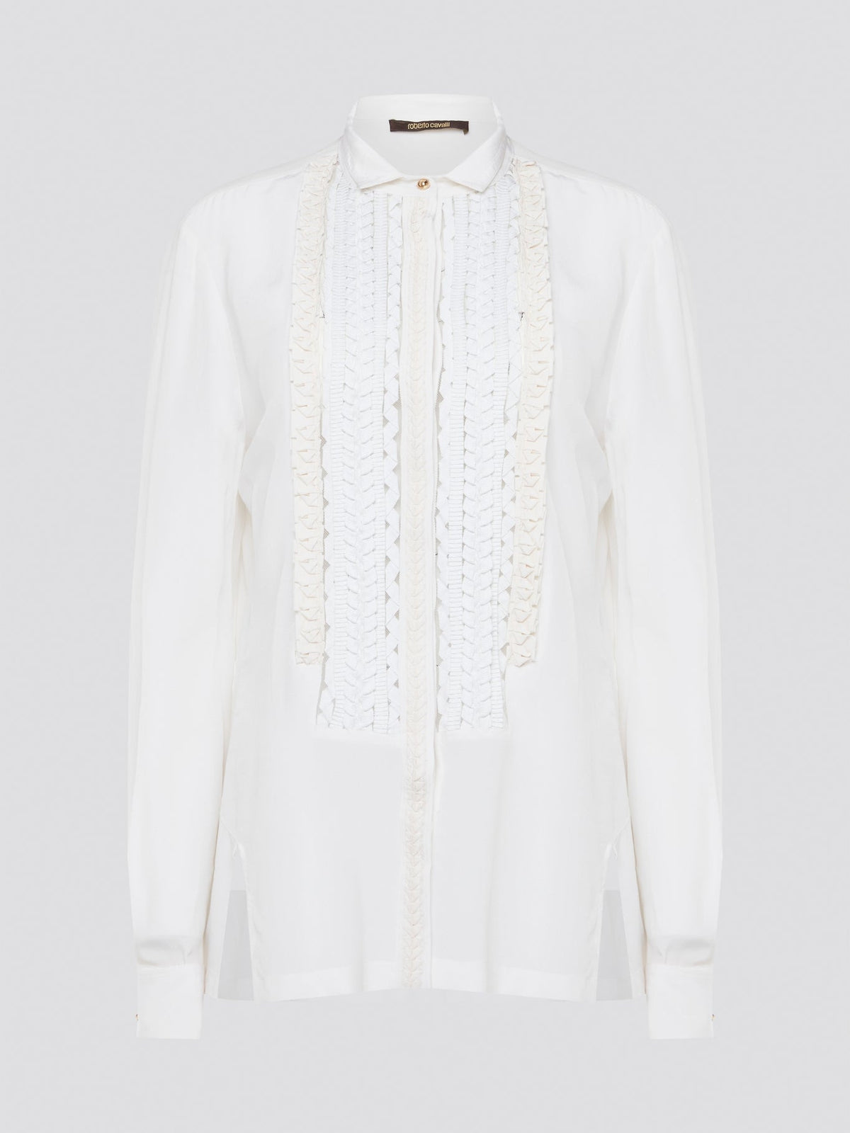 Elevate your wardrobe with this stunning Roberto Cavalli white detailed long sleeve shirt. Crafted with exquisite attention to detail, this shirt features intricate embroidery and embellishments that exude luxury and elegance. Perfect for adding a touch of sophistication to any ensemble, this statement piece is sure to turn heads wherever you go.