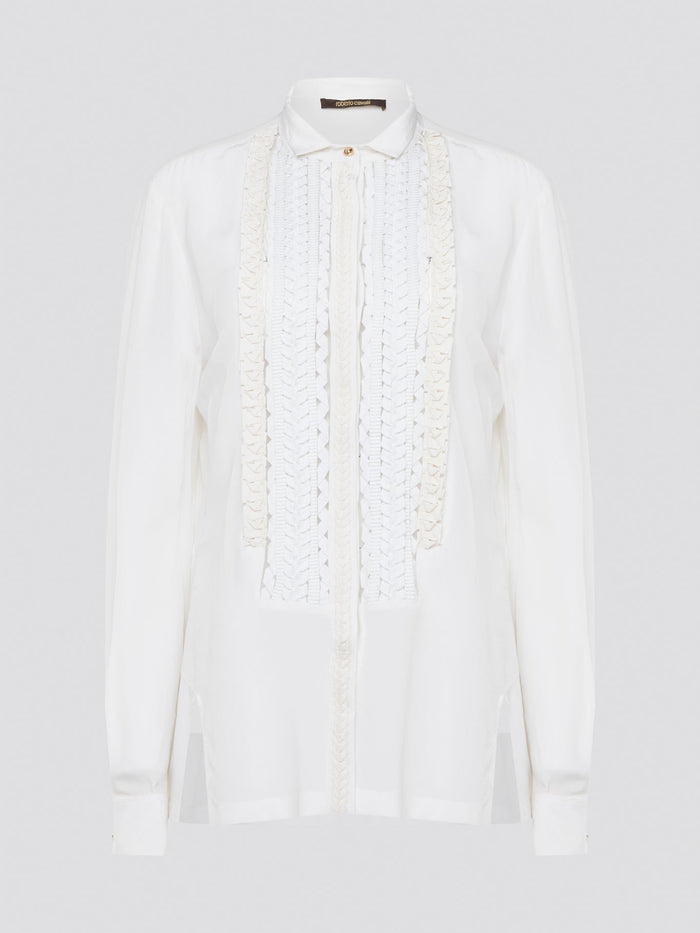 Elevate your wardrobe with this stunning Roberto Cavalli white detailed long sleeve shirt. Crafted with exquisite attention to detail, this shirt features intricate embroidery and embellishments that exude luxury and elegance. Perfect for adding a touch of sophistication to any ensemble, this statement piece is sure to turn heads wherever you go.