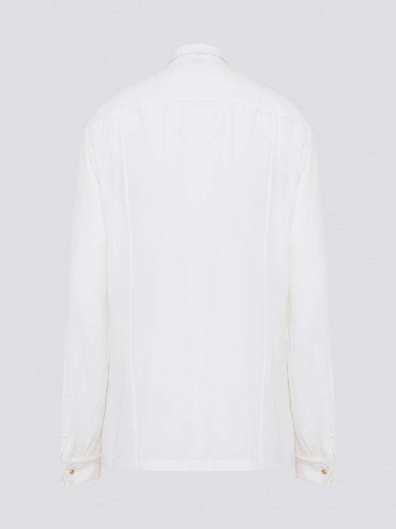 Elevate your wardrobe with this stunning Roberto Cavalli white detailed long sleeve shirt. Crafted with exquisite attention to detail, this shirt features intricate embroidery and embellishments that exude luxury and elegance. Perfect for adding a touch of sophistication to any ensemble, this statement piece is sure to turn heads wherever you go.