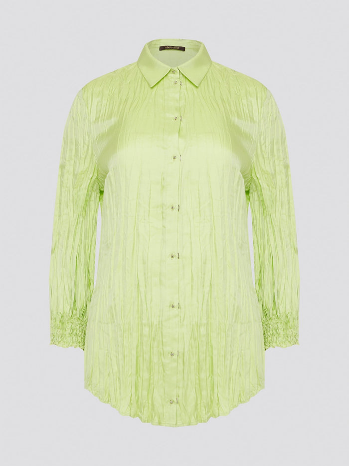 Step into the wild side with this striking green crinkled shirt from Roberto Cavalli. The vibrant hue and unique texture of the fabric will ensure you stand out from the crowd wherever you go. Embrace your fearless fashion sense and unleash your inner style icon with this must-have statement piece.