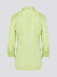 Step into the wild side with this striking green crinkled shirt from Roberto Cavalli. The vibrant hue and unique texture of the fabric will ensure you stand out from the crowd wherever you go. Embrace your fearless fashion sense and unleash your inner style icon with this must-have statement piece.