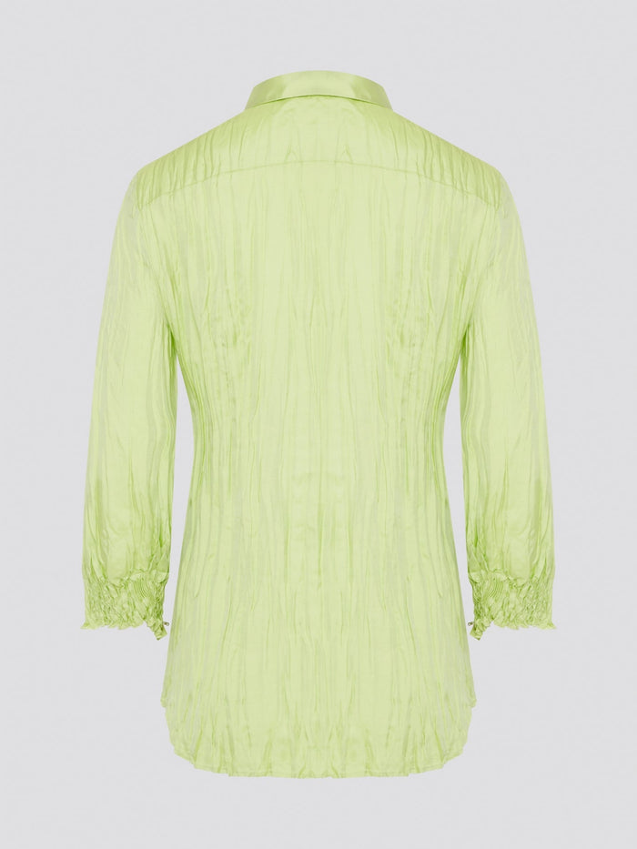 Step into the wild side with this striking green crinkled shirt from Roberto Cavalli. The vibrant hue and unique texture of the fabric will ensure you stand out from the crowd wherever you go. Embrace your fearless fashion sense and unleash your inner style icon with this must-have statement piece.