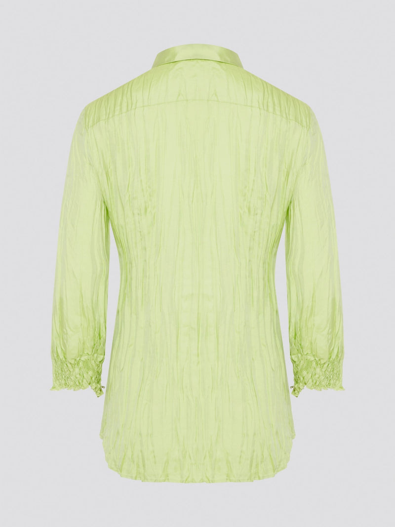 Step into the wild side with this striking green crinkled shirt from Roberto Cavalli. The vibrant hue and unique texture of the fabric will ensure you stand out from the crowd wherever you go. Embrace your fearless fashion sense and unleash your inner style icon with this must-have statement piece.