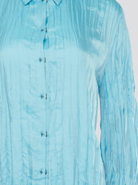 Elevate your wardrobe with the stunning Blue Crinkled Shirt from Roberto Cavalli. Crafted with meticulous attention to detail, this shirt features a unique crinkled texture that adds depth and dimension to any outfit. Whether you're dressing it up for a night out or keeping it casual for a day at the office, this shirt is sure to turn heads and make a statement.