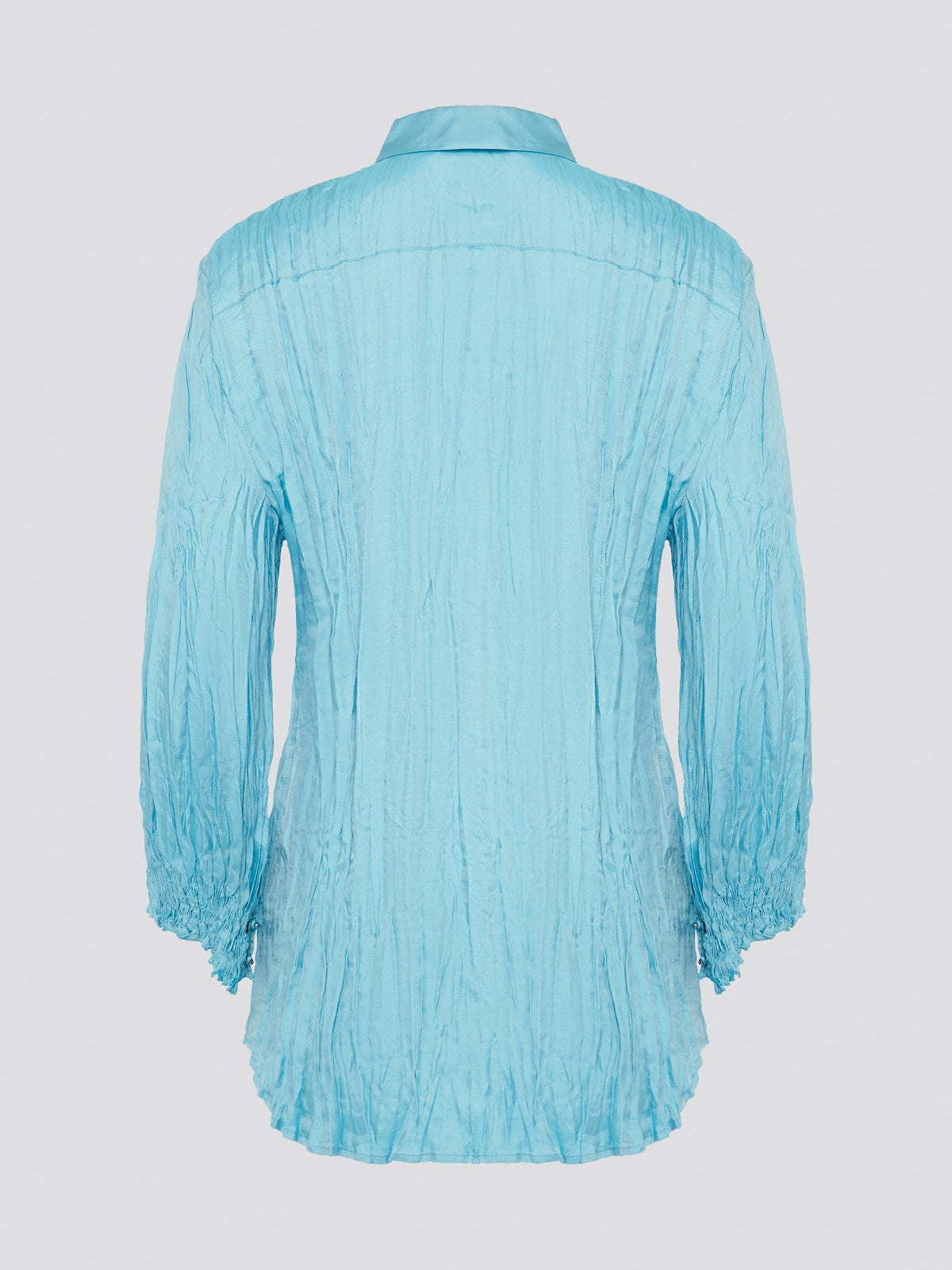 Elevate your wardrobe with the stunning Blue Crinkled Shirt from Roberto Cavalli. Crafted with meticulous attention to detail, this shirt features a unique crinkled texture that adds depth and dimension to any outfit. Whether you're dressing it up for a night out or keeping it casual for a day at the office, this shirt is sure to turn heads and make a statement.