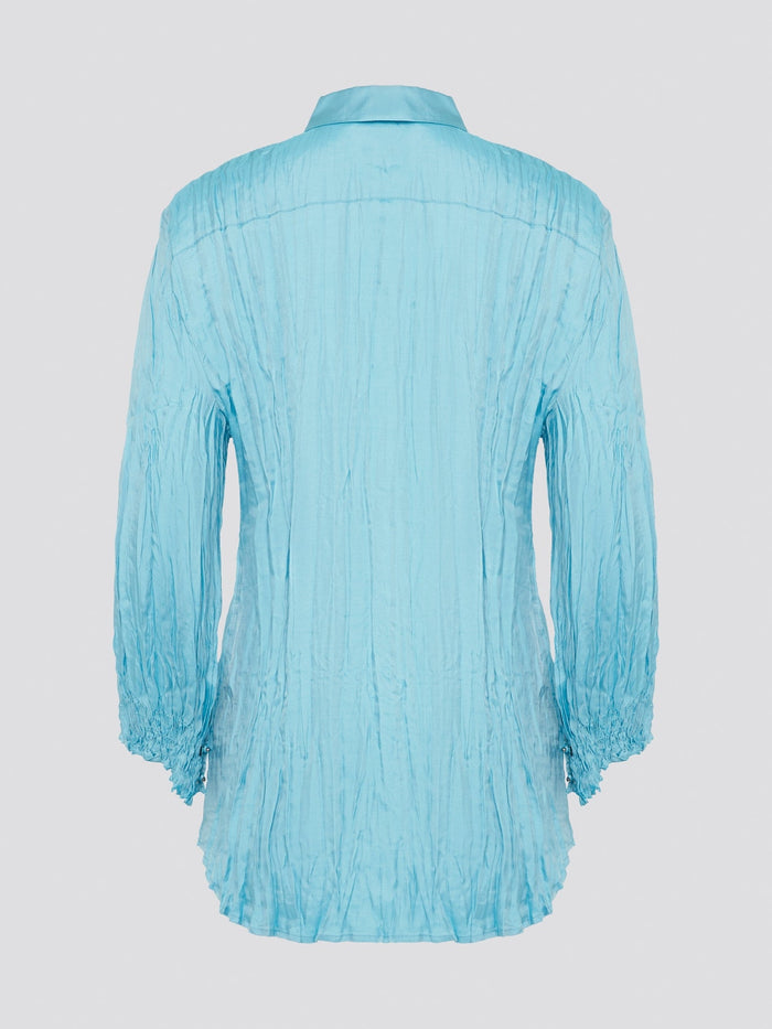 Elevate your wardrobe with the stunning Blue Crinkled Shirt from Roberto Cavalli. Crafted with meticulous attention to detail, this shirt features a unique crinkled texture that adds depth and dimension to any outfit. Whether you're dressing it up for a night out or keeping it casual for a day at the office, this shirt is sure to turn heads and make a statement.