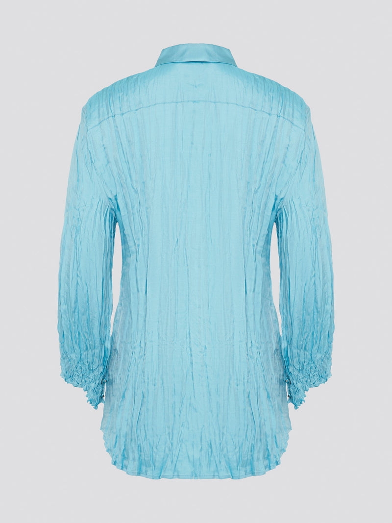 Elevate your wardrobe with the stunning Blue Crinkled Shirt from Roberto Cavalli. Crafted with meticulous attention to detail, this shirt features a unique crinkled texture that adds depth and dimension to any outfit. Whether you're dressing it up for a night out or keeping it casual for a day at the office, this shirt is sure to turn heads and make a statement.