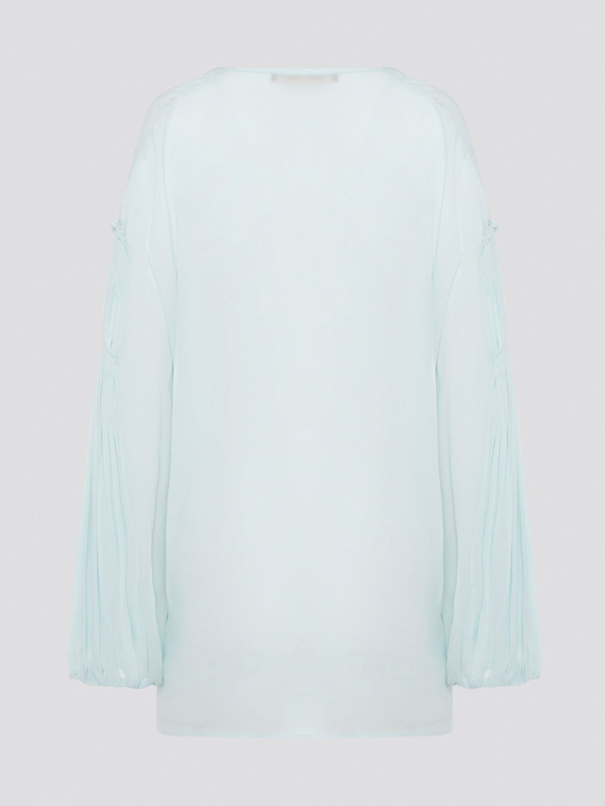 Step up your fashion game with this stunning Mint Green Tie Front Blouse by Roberto Cavalli. The delicate mint green hue and flattering tie front detail will make you stand out in any crowd. Pair it with your favorite jeans for a casual daytime look or dress it up with some sleek trousers for a night out on the town.