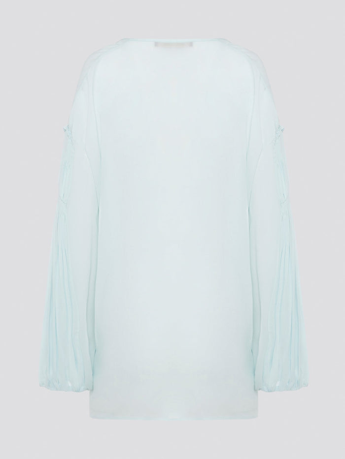 Step up your fashion game with this stunning Mint Green Tie Front Blouse by Roberto Cavalli. The delicate mint green hue and flattering tie front detail will make you stand out in any crowd. Pair it with your favorite jeans for a casual daytime look or dress it up with some sleek trousers for a night out on the town.