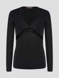 Step into elegance with the Black Lace Panel Top by Roberto Cavalli. This stunning piece features intricate lace detailing that adds a touch of romance to any ensemble. Dress it up with a sleek pencil skirt for a night out or pair it with jeans for a chic daytime look. Elevate your wardrobe with this timeless and versatile top.