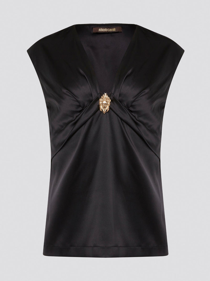 Make a bold statement with the Black Embellished Top by Roberto Cavalli, guaranteed to turn heads wherever you go. With intricate detailing and luxurious fabrics, this top is the epitome of high-end fashion. Elevate your wardrobe and stand out from the crowd with this stunning piece from one of the world's most renowned designers.