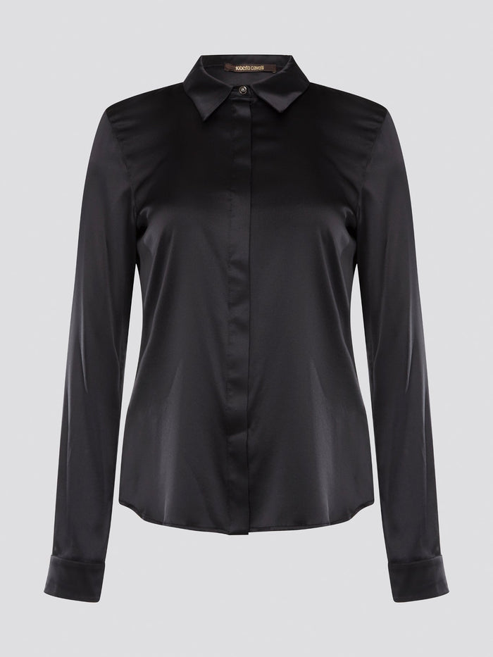 Step out in sleek and sophisticated style with this black satin shirt from Roberto Cavalli, a luxurious addition to your wardrobe. The silky smooth fabric drapes effortlessly, while the tailored fit adds a touch of elegance to any outfit. Perfect for a night out on the town or a special event, this shirt is sure to turn heads and make a statement.