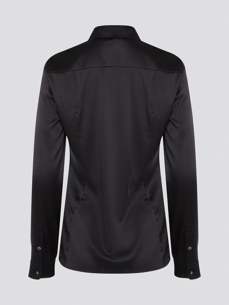 Step out in sleek and sophisticated style with this black satin shirt from Roberto Cavalli, a luxurious addition to your wardrobe. The silky smooth fabric drapes effortlessly, while the tailored fit adds a touch of elegance to any outfit. Perfect for a night out on the town or a special event, this shirt is sure to turn heads and make a statement.