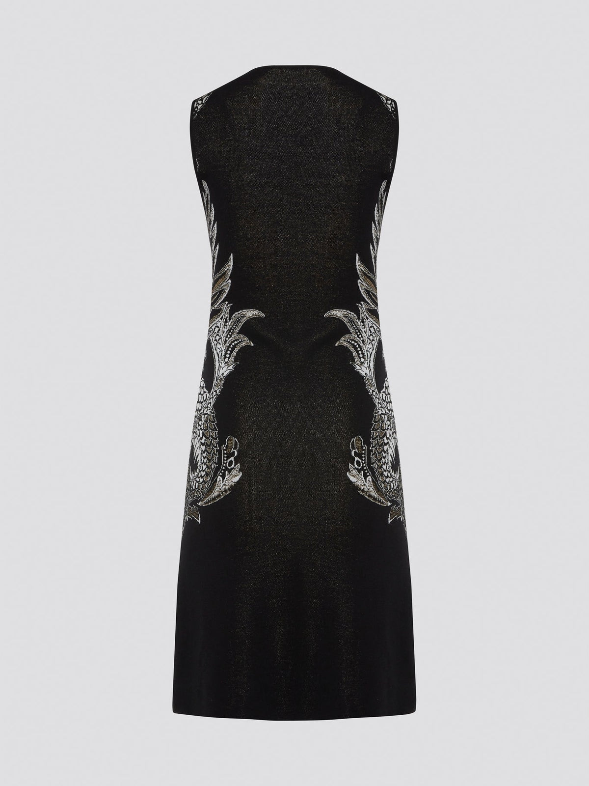 Elevate your wardrobe with the exquisite Knitted Bodycon Dress by Roberto Cavalli. Crafted with precision and care, this dress features intricate knitted details that hug your curves in all the right places. Make a statement at any event with this luxurious and unique piece that exudes elegance and style.