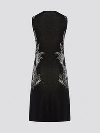 Elevate your wardrobe with the exquisite Knitted Bodycon Dress by Roberto Cavalli. Crafted with precision and care, this dress features intricate knitted details that hug your curves in all the right places. Make a statement at any event with this luxurious and unique piece that exudes elegance and style.