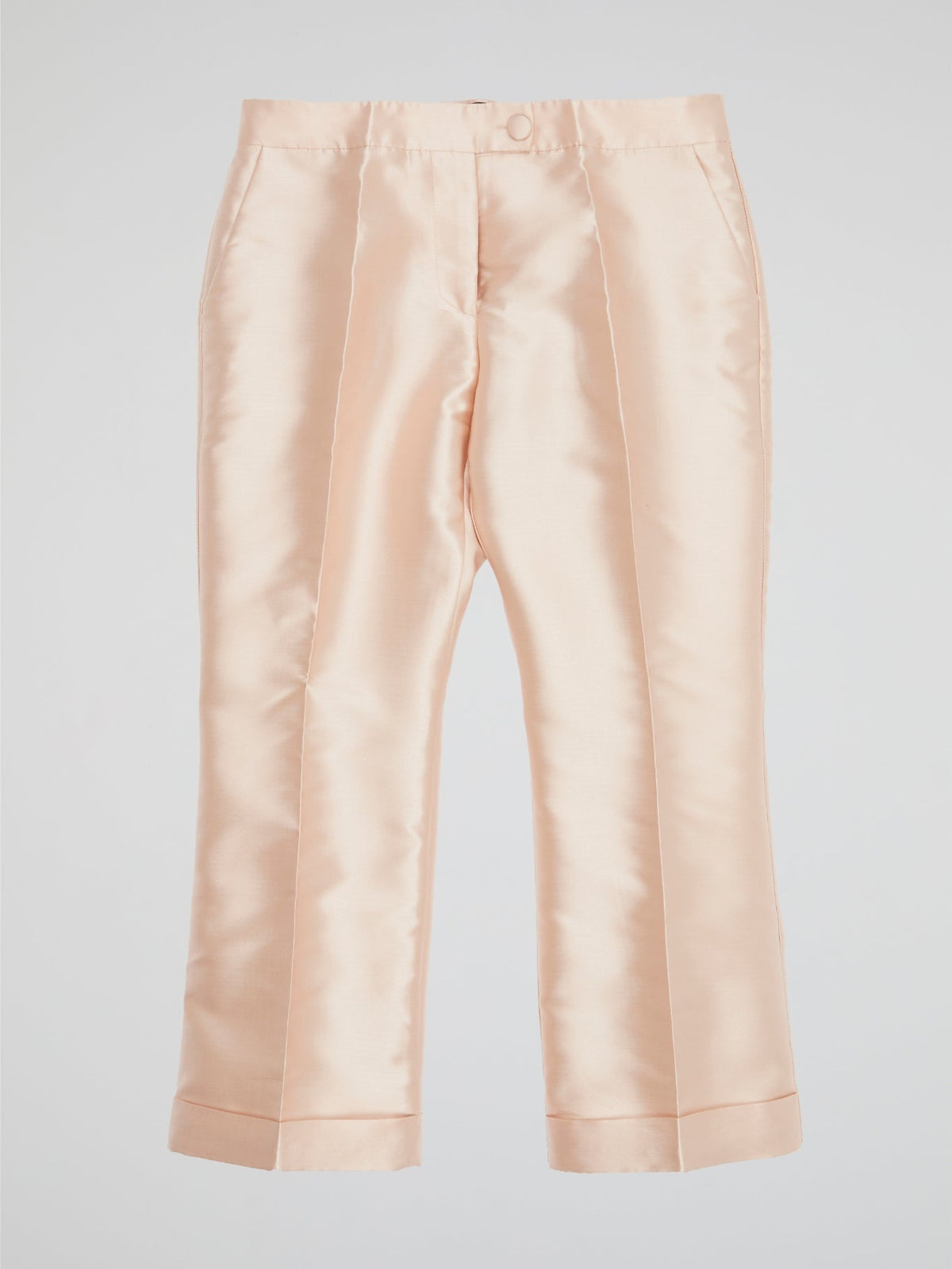 Elevate your wardrobe with our Beige Pleated Cropped Pants from Io Couture ��� a chic twist on a classic style. The pleated design adds a touch of sophistication, while the cropped length keeps it modern and trendy. Perfect for dressing up or down, these pants are a versatile addition to any fashion-forward closet.