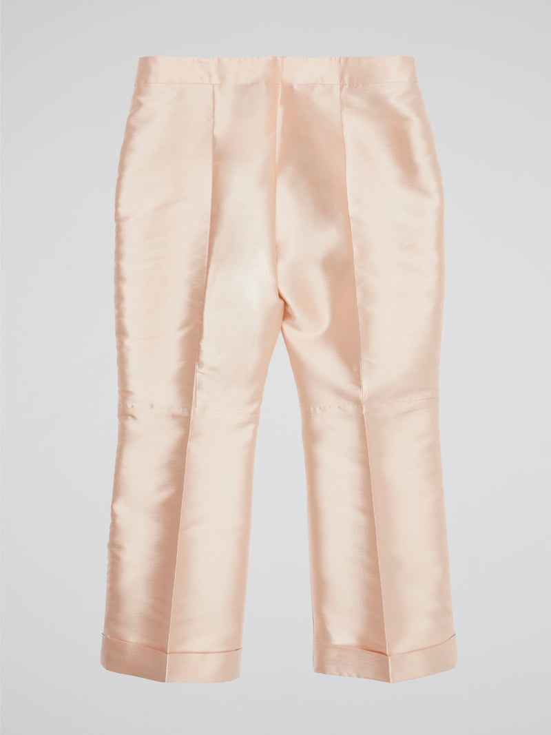 Elevate your wardrobe with our Beige Pleated Cropped Pants from Io Couture ��� a chic twist on a classic style. The pleated design adds a touch of sophistication, while the cropped length keeps it modern and trendy. Perfect for dressing up or down, these pants are a versatile addition to any fashion-forward closet.