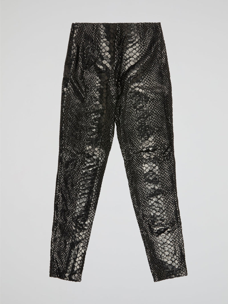 Unleash your wild side with our Black Reptilian Leather PantsIceberg, designed to make a bold statement. Crafted from high-quality faux leather with a sleek reptile texture, these pants are perfect for standing out in a crowd. Embrace your inner rockstar and take your style to the next level with these edgy and stylish pants.